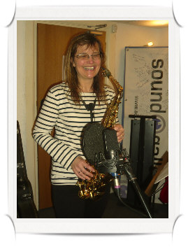 Ali Bamford playing saxophone with her band, Green Lane